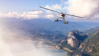 Fototapeta na wymiar Seaplane Flying over the touristic town and Mountains Landscape. Extreme Adventure Composite. 3D Rendering Airplane. Aerial Background Image from Squamish, British Columbia, Canada.