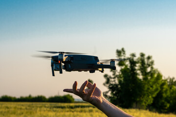 Safe quadcopter landing on the pilot's palm. Sommer drone flights.
