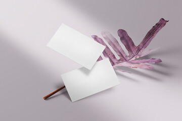 Clean minimal business card mockup floating on leaves
