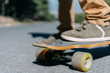 Close up of feet on a skateboard.