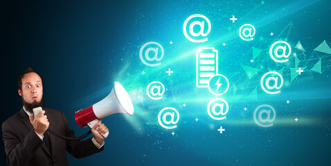 Young person with megaphone and technology related icon