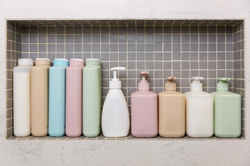 jars and bottles with cosmetic products on a shelf in the bathroom
