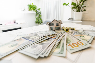 mortgage, investment, real estate and property concept. close up of home model, Thai money and...