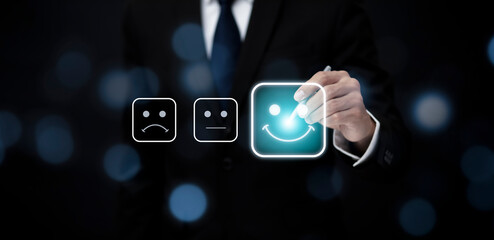 Businessman people are touching the virtual screen on the happy and unhappy Smile face icon in service in the black background, Customer service and Satisfaction concept ,