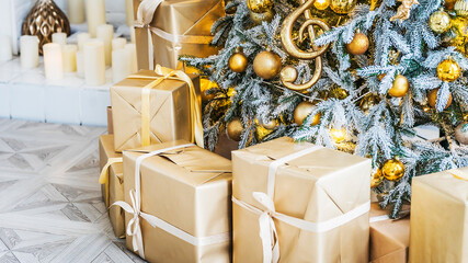 Christmas and New Year interior in light classic style. White room with Xmas Tree decorated, flashing garland, gold balls and box gifts. Bright New Year celebration décor. Winter Holiday Background