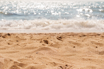 The coast with a yellow sandy beach and blue sea water