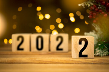 Happy New Year 2022 decoration background. Wooden blocks with numbers close-up