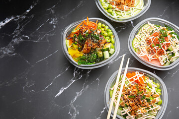 Japanese poke salad take away food on black marble background