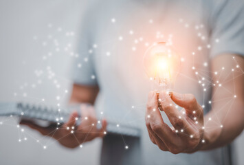 Concept creativity with light bulbs and energy power, Man hand holding light bulbs, ideas of new ideas with innovative technology, Creativity, bulb future technology, innovation background,