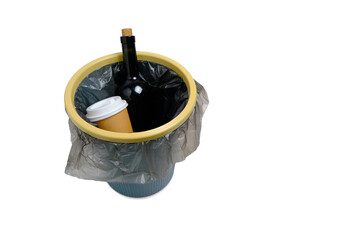 Trash can on white background and wine bottle and disposable coffee cup thrown into it.