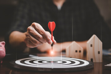 Targeting the business concept, Businessman touch red arrow dart to the virtual target dartboard,...