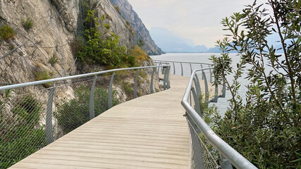 Cycle path in Limone sul Garda at the western bank of Lake Garda. Lombardy, northern Italy, Europe.