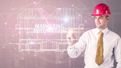 Handsome architect drawing with helmet