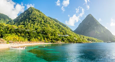 Foto op Canvas Caribbean beach with palms and straw umrellas on the shore with Gros Piton mountain in the background, Sugar beach, Saint  Lucia © vadim.nefedov