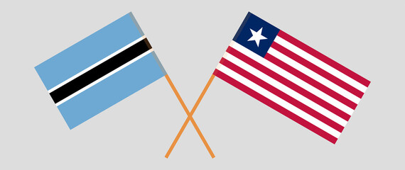 Crossed flags of Botswana and Liberia. Official colors. Correct proportion
