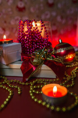 candle lights, red and gold christmas decoration on red background