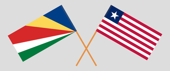Crossed flags of Seychelles and Liberia. Official colors. Correct proportion