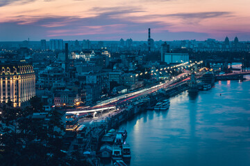 panorama of the city of Kiev. Ukraine. hotels, restaurants, factories and plants. shops and cafes. people walk the streets, cars drive through the city. Dnieper, boats and ships