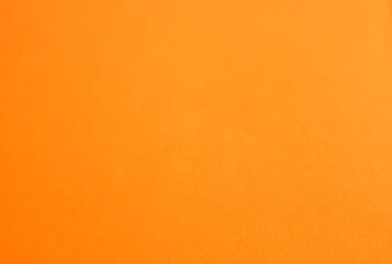Orange paper background with empty copy space for text. Minimalist backdrop. Empty template design