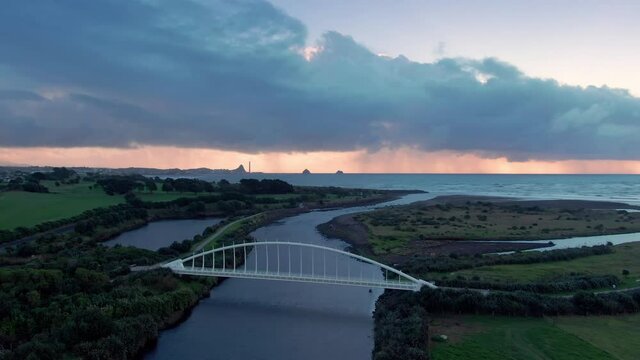 Aerial: Te Rewa Rewa Bridge at sunset, New Plymouth, Taranaki, New Zealand