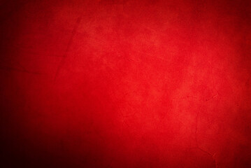 Red genuine leather as a background closeup. Horizontal photograph of a suede texture.