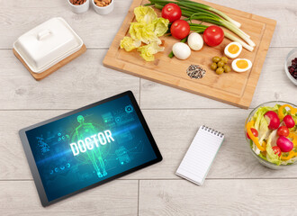 Tablet Pc with fruits, medical concept