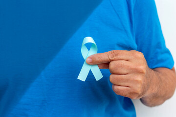 Blue november - man holding blue ribbon