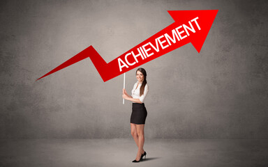 Fototapeta premium Young business person in casual holding road sign