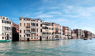 Fototapeta na wymiar Architecture of Venice, Italy. Historic houses reflects in the water, traditional architecture on Grand Canal in Venice.
