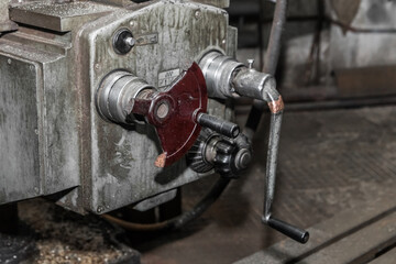 Part of the controls and handle of the milling old machine of the equipment in the industrial plant
