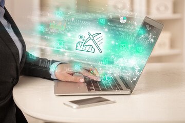 Young man watching stock market on laptop