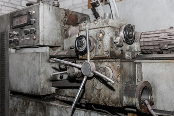 Fototapeta na wymiar Lathe revolver old machine equipment for locksmith work in an industrial plant