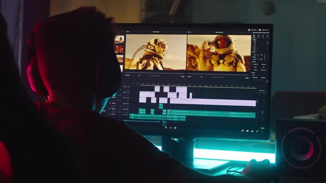 Teenager editing astronaut video at night