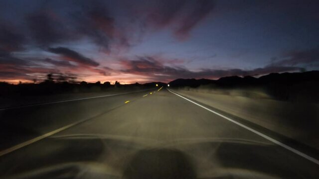 Desert highway night driving time lapse on Fort Tejon Road near Palmdale and Littlerock California.