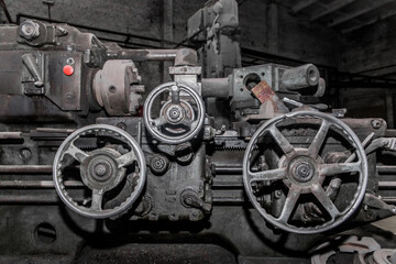 Fototapeta na wymiar Old milling machine equipment and tools for metal processing in workshop on industrial plant