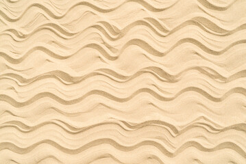 Drawing of waves on the sand on the beach, sand pattern