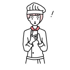 立ってスマートフォンを操作して何かに気づいて驚いた調理師の女性