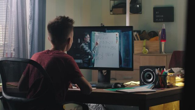Teen student studying math with online teacher