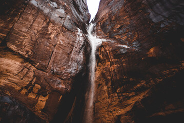waterfall through moab sandstone