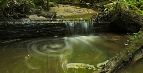 Wild waterfall in spiring day, Latvia.