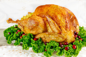 Roasted turkey with cranberries on christmas table.