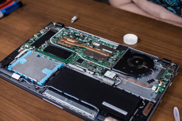 Disassembled laptop on the engineer's desk. Laptop before repair. Computer equipment repair shop