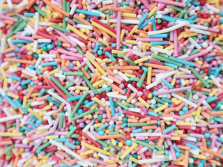 Multicolored confetti. Children's holiday. Party. Sprinkle for Easter cakes. Isolate. Baking, baking decor. Sweets.