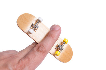 Man playing fingerboard on white background.