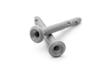 Two dowels on white. Close up.