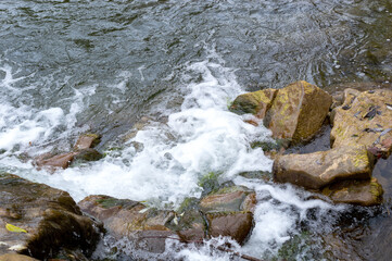 Waterfall on mountain river. Close up.