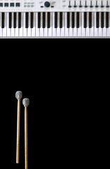 Musical background with musical keys and drum sticks top view.
