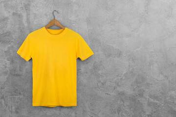 Yellow Blank Cotton Tshirt Hanging Center Gray Concrete Empty Wall Background.