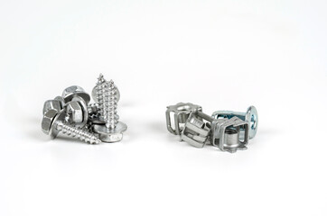 Turnkey fastening screws. Metal brackets for self-tapping screws. Close up. Isolated on white...