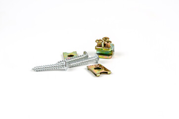 Turnkey fastening screws. Metal brackets for self-tapping screws. Close up. Isolated on white...